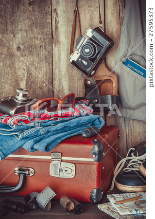 Suitcase, clothing, sunglasses and retro camera Suitcase, clothing, sunglasses and retro camera 27595373
