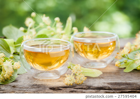 Two cups of healthy linden tea, herbal medicine. 27595404