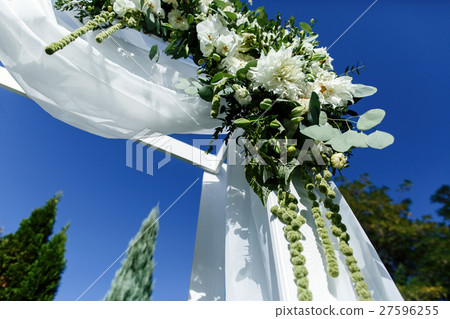 Look from below at garland of white flowers  27596255