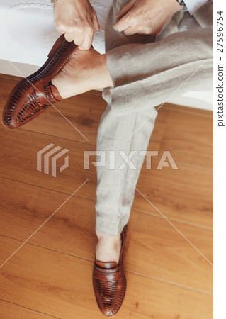 Man with wooden bracelet Man with wooden bracelet 27596754