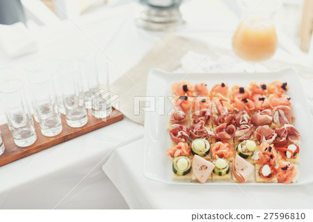 Tasty appetizers of fish and vegetables served Tasty appetizers of fish and vegetables served 27596810