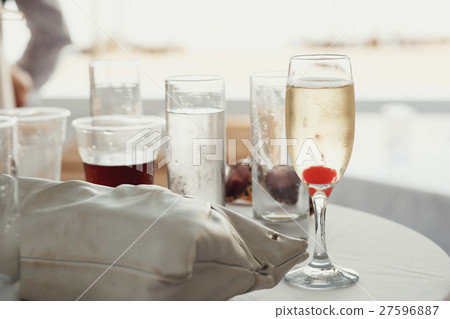 Champagne flutte with cherry stands  27596887