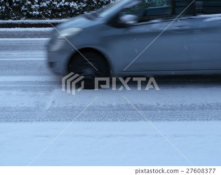 Passenger car running on the snow road 27608377