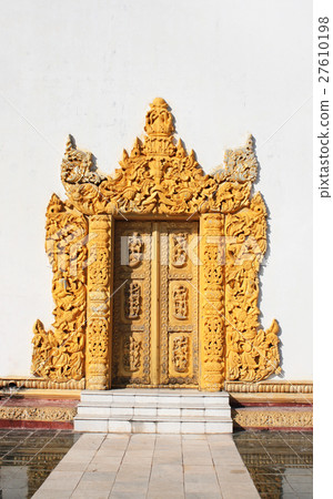 Old wooden door with carved ornament, Myanmar  27610198