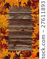 maple leaves and wooden background 27611893