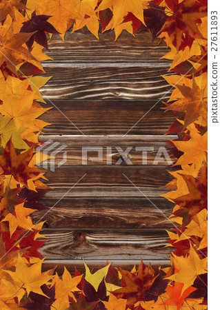 maple leaves and wooden background 27611893