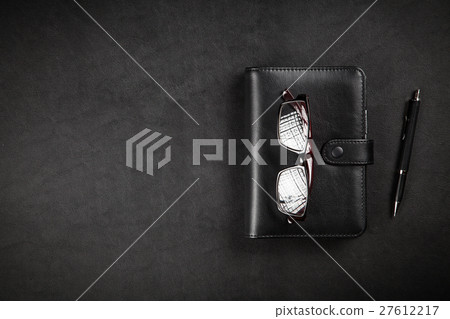Black organizer on a table Black organizer on a table 27612217