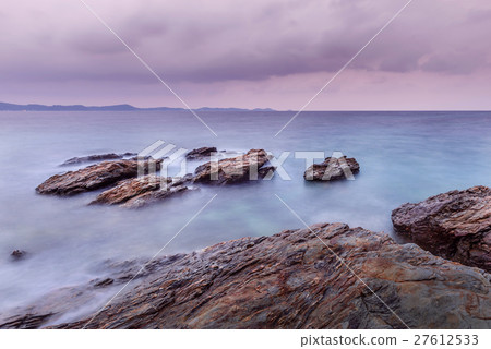 Long exposure shot. Sea scape with stone beach Long exposure shot. Sea scape with stone beach 27612533