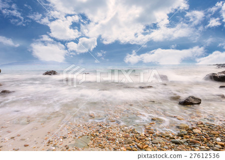 Long exposure shot. Sea scape with stone beach Long exposure shot. Sea scape with stone beach 27612536