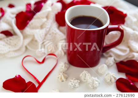 red mug with hot chocolate standing 27612690