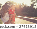 Happy mother and daughter playing in park. 27613918