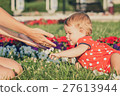 Happy mother and daughter playing in park. 27613944