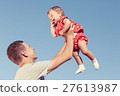 Happy brother and sister playing in park. 27613987