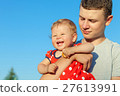 Happy brother and sister playing in park. 27613991