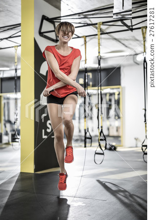 Sportive girl does exercise in gym Sportive girl does exercise in gym 27617281