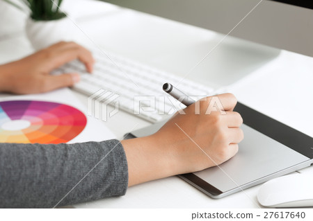 graphic design using digital pen tablet on desk 27617640