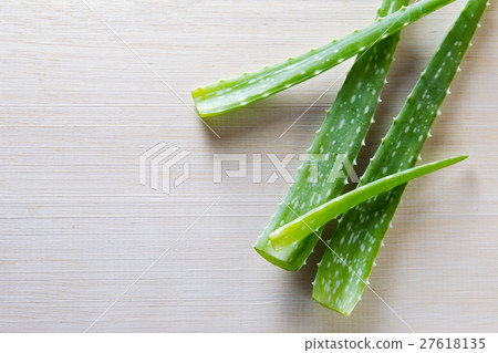 Aloe vera isolated on wooden board background Aloe vera isolated on wooden board background 27618135