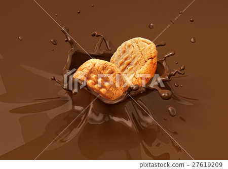 Two cookies  splashing into liquid chocolate. 27619209