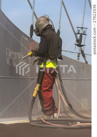 Man with helmet working on a bridge construction 27622036