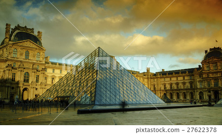 Louvre in dusk with orange cloud Louvre in dusk with orange cloud 27622378