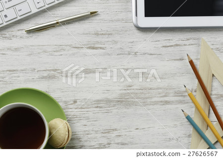 Office workplace with cup and macaroons 27626567