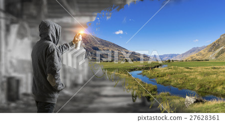 Guy drawing with spray 27628361