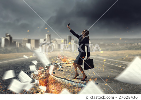 Businesswoman catching moment on her mobile 27628430
