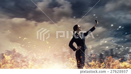 Businesswoman catching moment on her mobile 27628937