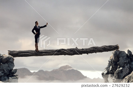 Businesswoman catching moment on her mobile 27629232