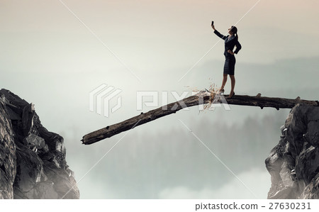 Businesswoman catching moment on her mobile Businesswoman catching moment on her mobile 27630231