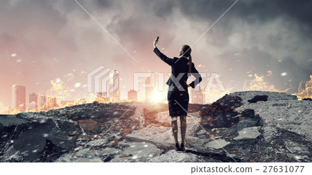 Businesswoman catching moment on her mobile 27631077