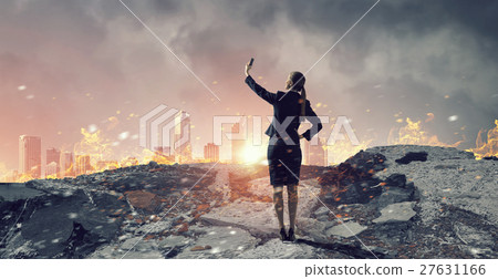 Businesswoman catching moment on her mobile Businesswoman catching moment on her mobile 27631166