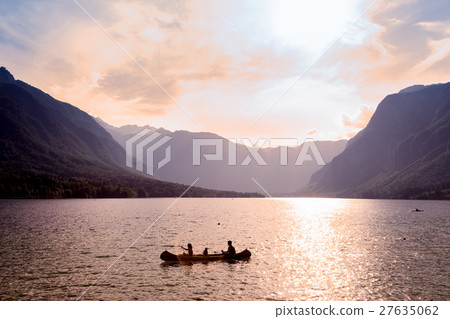 Family rowing in canoe boat on beautiful lake Family rowing in canoe boat on beautiful lake 27635062