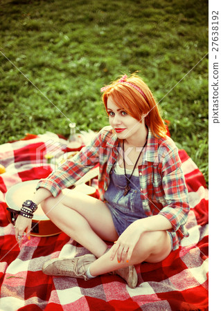 Young redhead hipster woman on the picnic 27638192