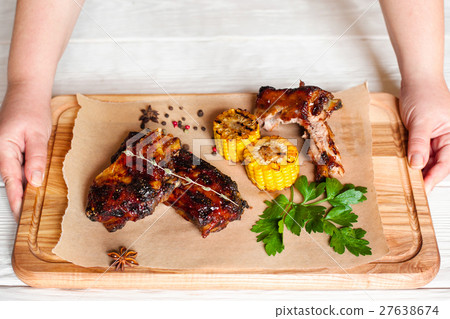 Put tray with barbecue meat on table free space 27638674