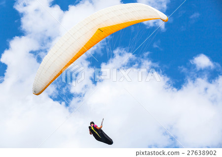 Amateur paraglider in the blue sky 27638902
