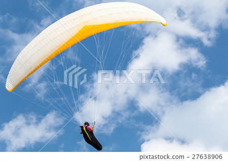 Amateur paraglider in blue sky with clouds Amateur paraglider in blue sky with clouds 27638906