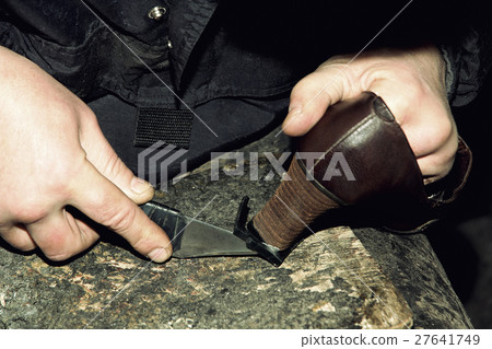 Shoemaker is repairing shoe taken closeup. Shoemaker is repairing shoe taken closeup. 27641749