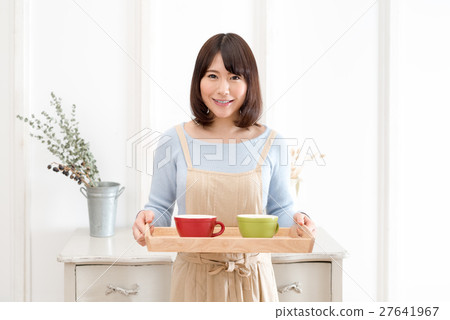 Young housewife household chores Young housewife household chores 27641967