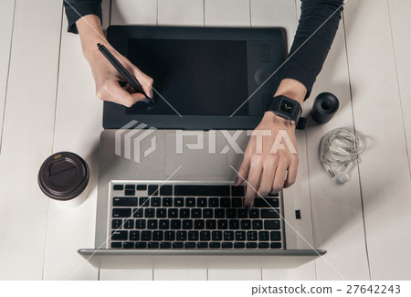 Girl working on a laptop. 27642243