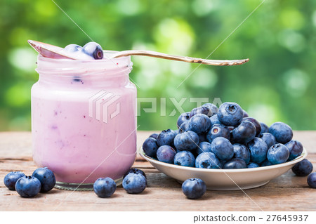 Fresh blueberries yogurt and saucer of bilberries 27645937