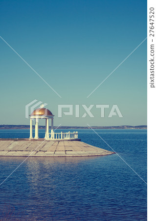 Classic gazebo with column on shore Classic gazebo with column on shore 27647520