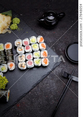 Sushi roll with on a stone plate and background. Sushi roll with on a stone plate and background. 27648054