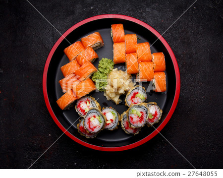 Sushi roll with on a stone plate and background. 27648055