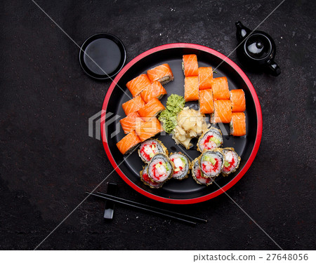 Sushi roll with on a stone plate and background. 27648056