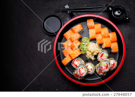 Sushi roll with on a stone plate and background. Sushi roll with on a stone plate and background. 27648057