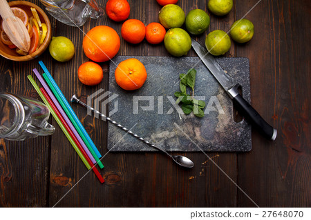 Fresh ripe citruses on a stone background. 27648070
