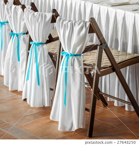 Wedding chairs, decorated with white fabric 27648250