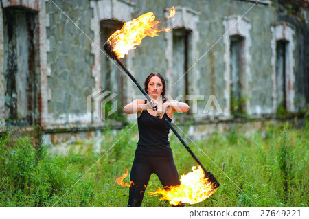 Fire show girl with flaming torches Fire show girl with flaming torches 27649221