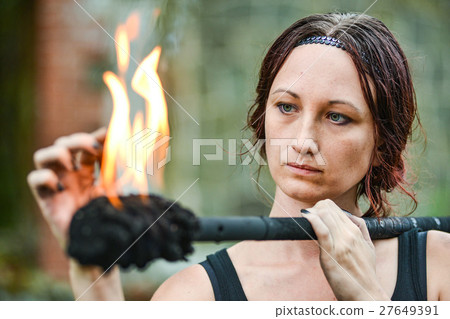 Fire show girl with flaming torches Fire show girl with flaming torches 27649391